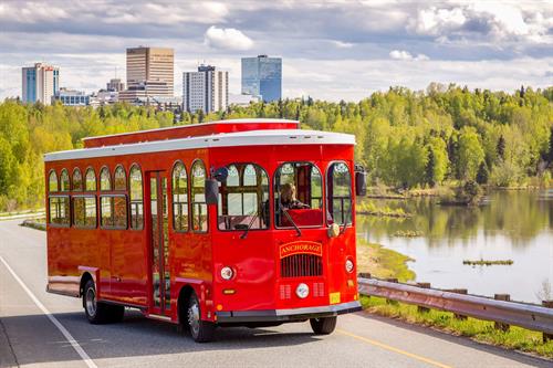 Gallery Image Anhcorage_Trolley_with_downtown_in_skyline_copy(1).JPG