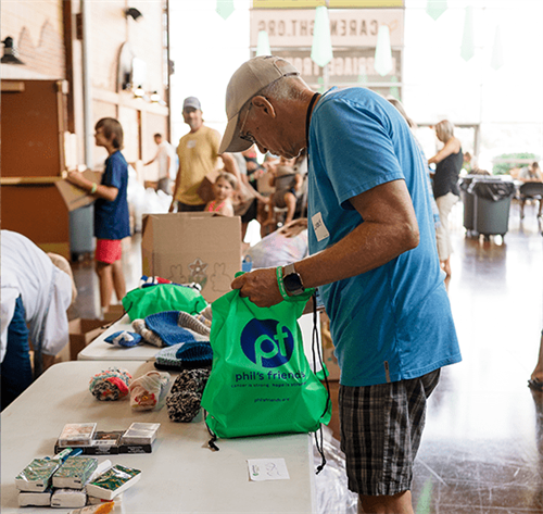 Gallery Image man_packing_bag.png