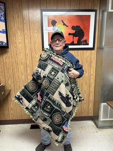 Gallery Image man_with_army_blanket.jpeg