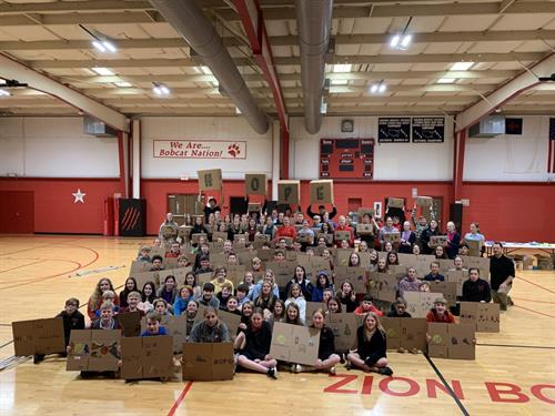 Gallery Image school_group_with_care_package_boxes.jpg