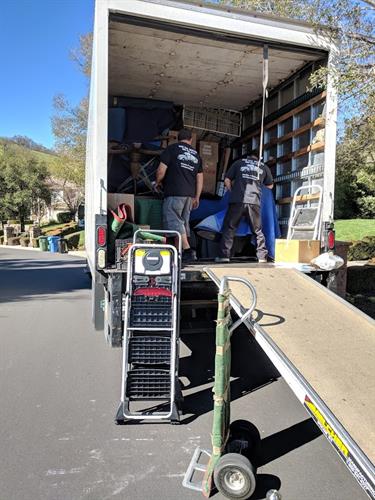 Movers carefully loading our clients personal belongings 