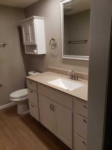 Bathroom Remodel using Onyx Collection products, Delta, and Shaw Floors
