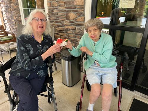 Our residents enjoying Watermelon on a hot day