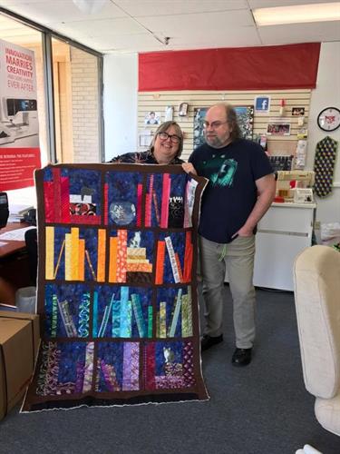 Owners Cathy & Mike displaying a quillow in progress Owners Cathy & Mike displaying a quillow in progress