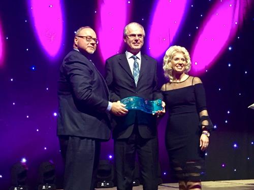 2019 Greater Charlottetown Area Chamber Volunteer of the Year Award, presented by John Gaudet from Maritime Electric, and Jennifer Evans, GCACC President