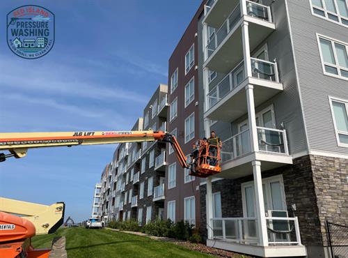 Window cleaning an apartment building.