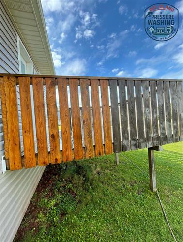Pressure washing a deck.