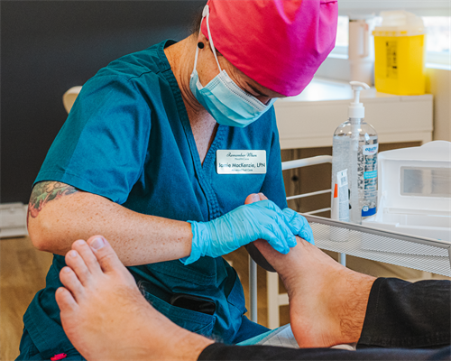Jamie, LPN, one of RWHC's foot care nurses, providing foot care