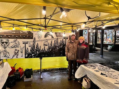 Owners Nate and Kelsey at there booth at Whitefish's Christmas Stroll.