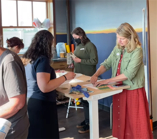 Students learning fabric collage at our Maker of The Month Workshop.