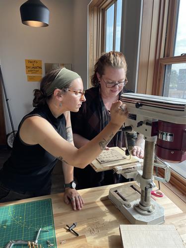 Members using the drill press from our Tool Library. Members using the drill press from our Tool Library.