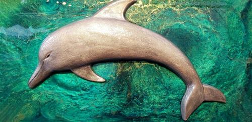 3-D dolphincreated from volcanic ash & sand on canvas