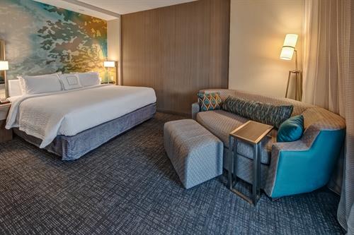 Stay in our king guest room and make traveling a pleasure! With plush bedding and crisp linens you get all the comforts of home and more! Room features wireless Internet access, a flat-screen TV, a work desk, mini-fridge, microwave and coffee/tea service