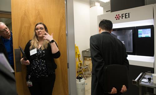 Dr. Tera Lavoie leads a tour group in the Transmission Electron Microscope lab Dr. Tera Lavoie leads a tour group in the Transmission Electron Microscope lab