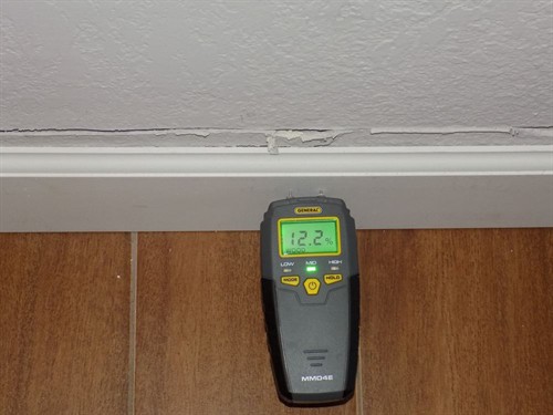 Moisture meter reading during a water damage inspection, Camden, NJ