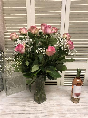 Roses are selected and artfully arranged. Premium, long stem roses with soft babies breath.  Other colors are available.