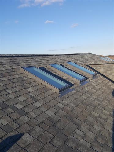 Residential Shingle roofing with skylights