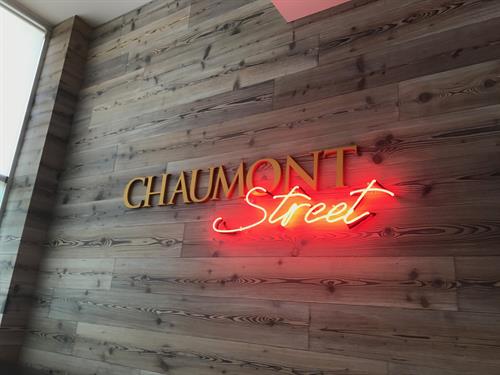 Chaumont Street dimensional sign with red neon