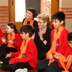 Artistic Director, Sue Fink with members of the youth chorale