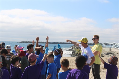 Coast Academy Founder Devin Bonney giving a lecture about the Ballona Creek and the Ocean Cleanup Interceptor