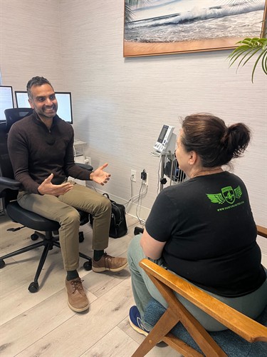 Dr. Gupta with a weight loss patient.