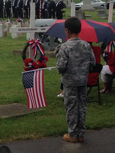 Handing out free American Flags at Memorial Day event at South Park Cemetery