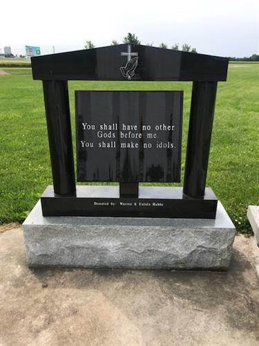 Bible with engraved verse in granite at the cross in Effingham