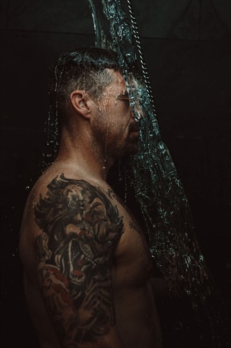 Rinsing off with the bucket shower.       Credit for photo goes to @slatemediacreative and @hannahlorsch