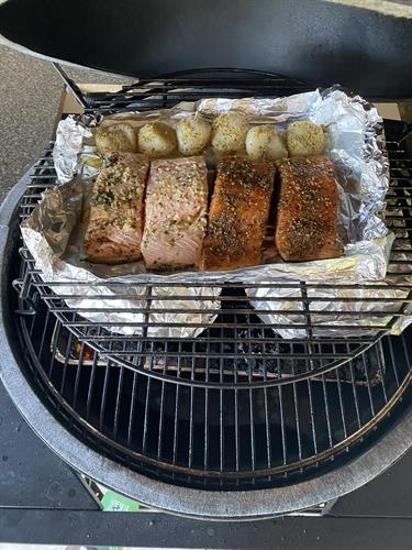 2 Pulled Pork Shoulders wrapped during final leg of preparation and Grilled Salmon and Scallops were marinated in special seafood marinade and special seafood Spice Rub 