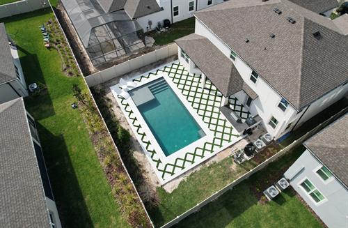 Gallery Image 3_wesley_chapel_whispering_oaks_preserve_epperson_lagoon_pebbletec_pebblesheen_french_grey_marble_turf_Jandy.JPG