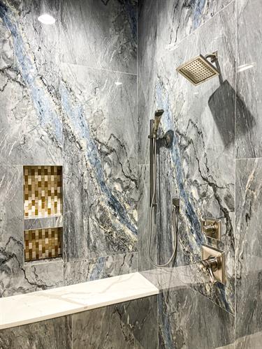 Milano Kitchen and Bath will make you feel like royalty with the exquisite Armani Crema Porcelain surrounding the bath, the stunning Calacatta countertops, and the gorgeous Bardiglio porcelain shower. 