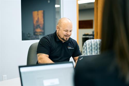 In the meeting room, ideas take shape—Clarity team collaborating to keep clients moving forward.