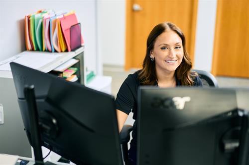 Organized and focused—Clarity's Office Manager, Paige, is ready for whatever the day brings.