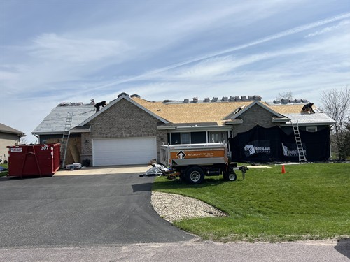 Badgerland Exteriors & Solar crew in action: Property protection practices in place during a roof replacement in Prairie du Sac, WI