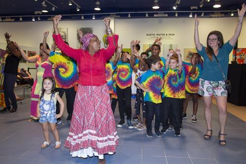 Queen Maxine leads a cultural dance class with kids and families