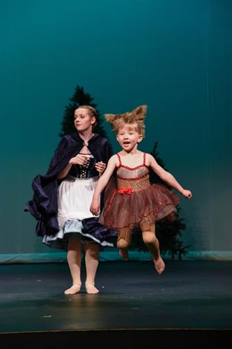 Young dancer jumps as a wolf pup in Spotlight's 2019 production of Beauty & the Beast.