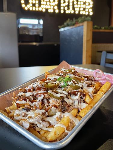 Loaded Fries with your choice of Brisket, Pork or Chicken