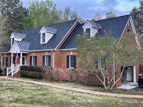 Architectural Shingles and standing seam metal on dormers