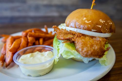 Minuta de Pescado - Battered Fish Fillet with onion,  lettuce, tomato and Special Sauce served on a house-made bread roll.