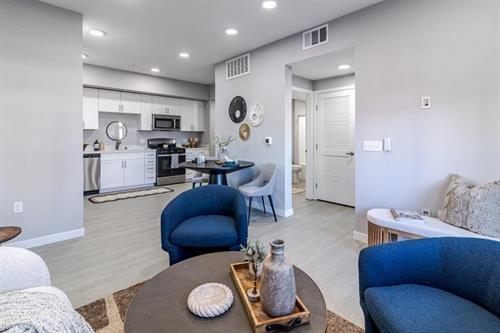 living room with a view to the kitchen and dining area
