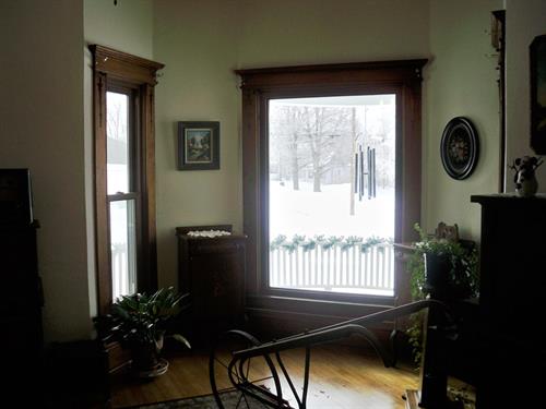 1900's home with Replacement Double Hungs featuring woodgrain