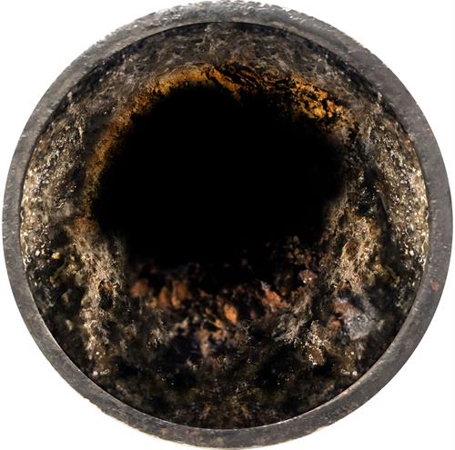 Before picture of cast iron pipe that needs descaled and cleared