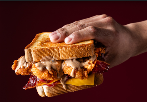 Our chicken club sandwich is masterfully crafted with three juicy chicken tenders layered with rich brisket bacon, a slice of american cheese drizzled with our signature Layne’s sauce. It comes with crinkle-cut fries and a 22oz drink.