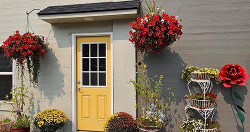 Yellow door Main Entrance to both suites upstairs and downstairs apartments 