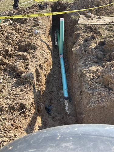 Sewer line replacement, and excavating