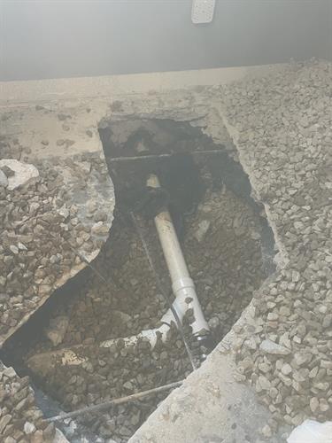 Sewer line repair under concrete