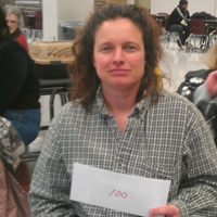 An RFCU member shows off her $100 cash prize at our 2013 annual meeting.