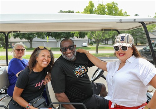 Manager Jamar Hardy driving the golf cart at our Field Day