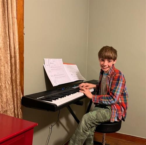 A student musician during his music lessons provide by CAC (October 2021). 