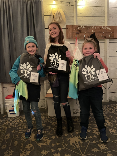 Three sisters receiving art kits (December 2021)